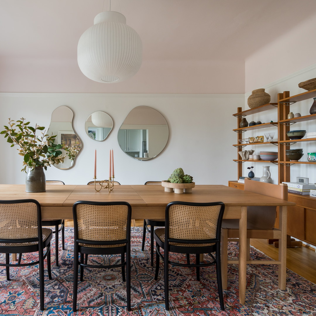 a dining room with a table and chairs