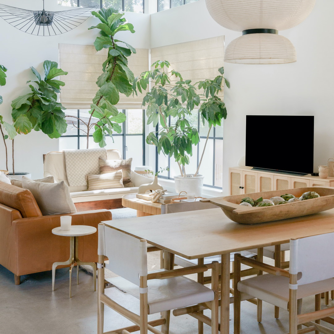 a living room filled with furniture and a flat screen tv