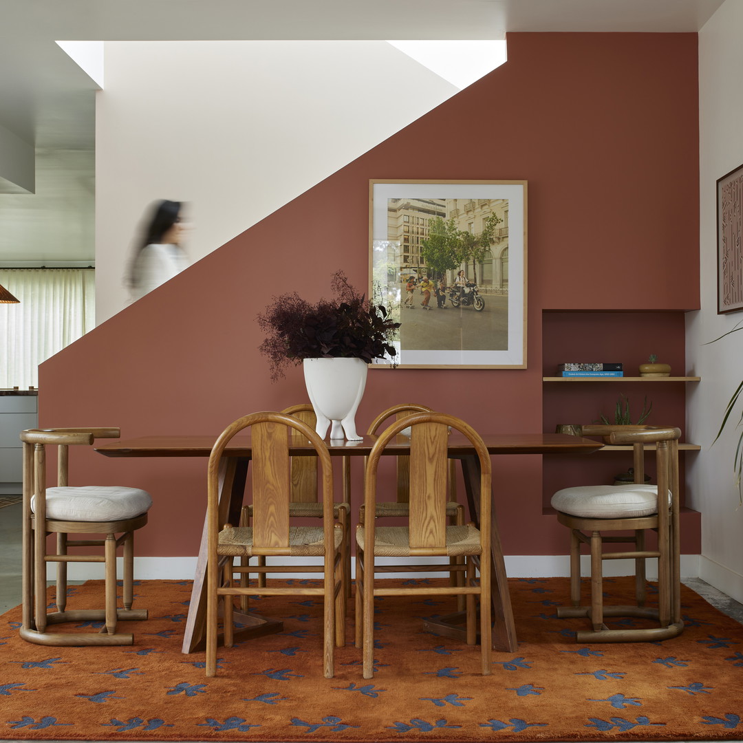 a dining room with a table and chairs