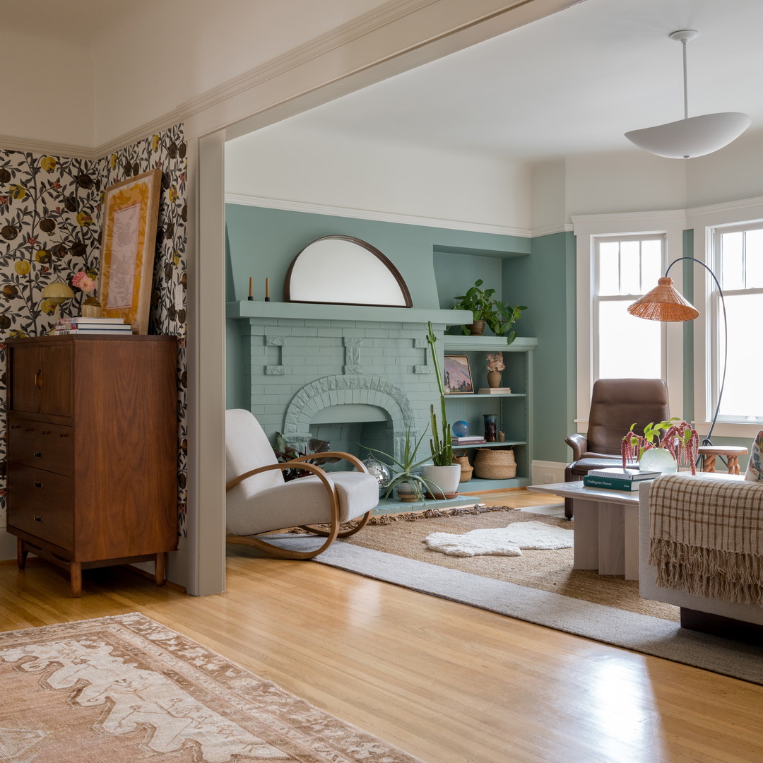 a living room filled with furniture and a fire place