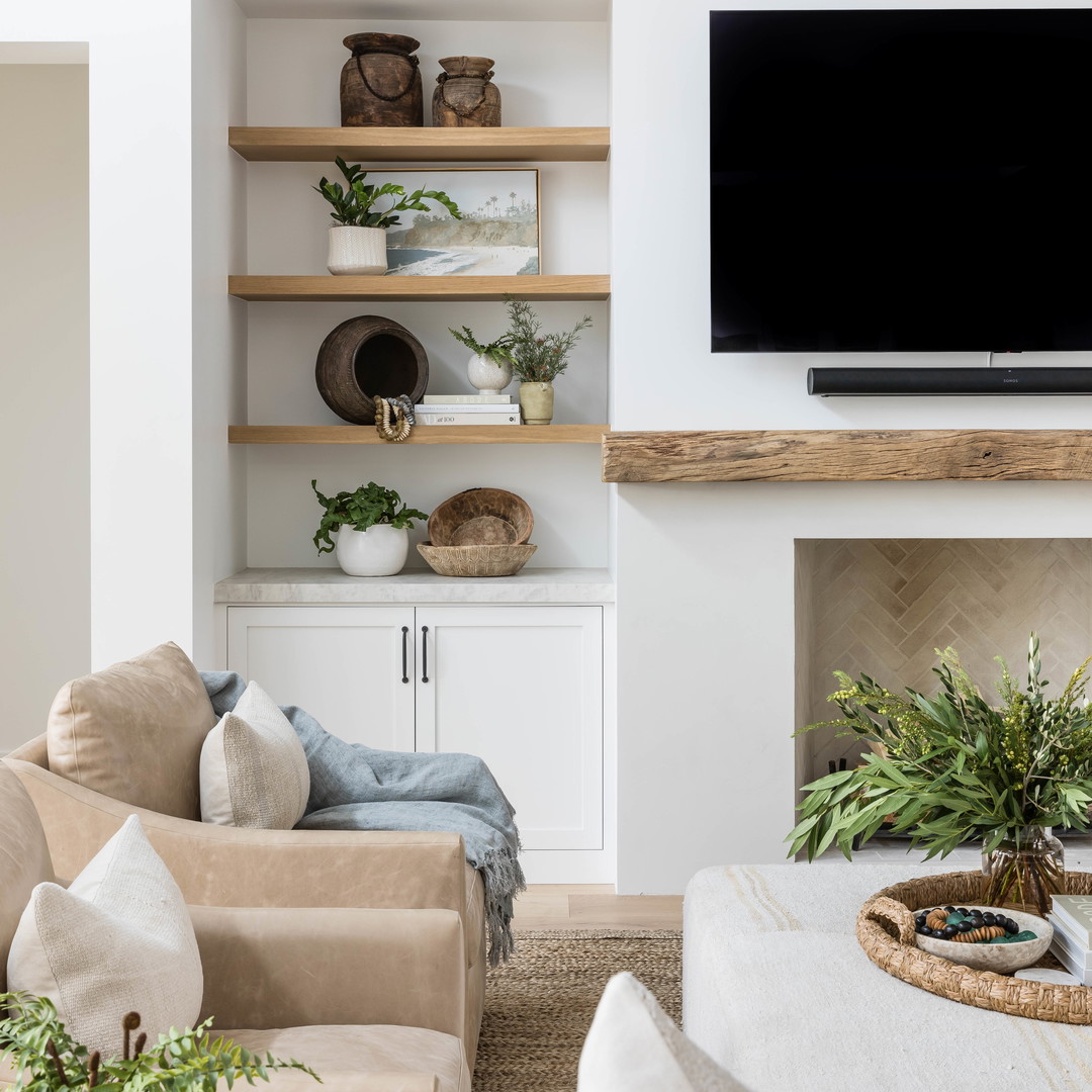 a living room filled with furniture and a flat screen tv