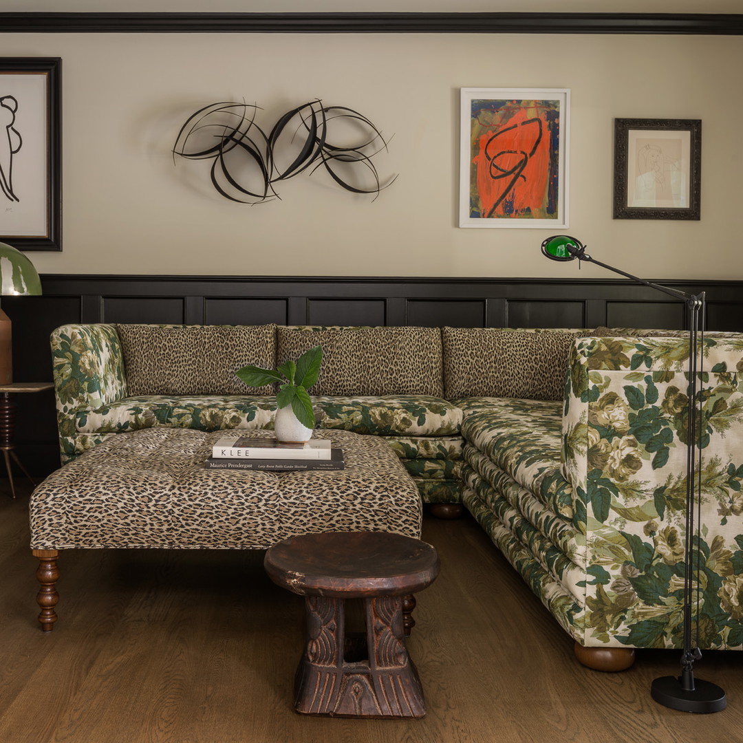 a living room filled with furniture and a book shelf