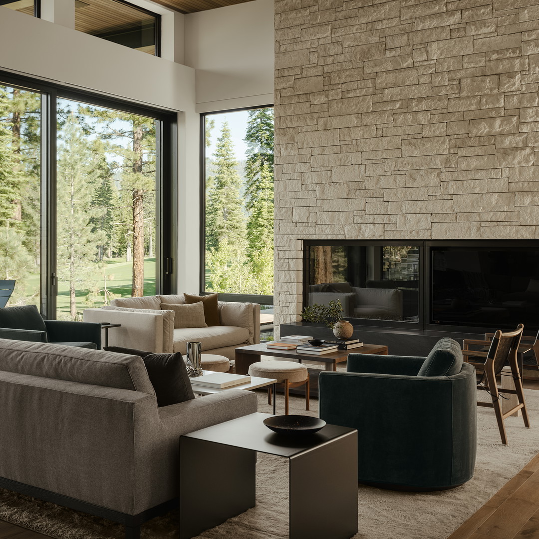 a living room filled with furniture and a fire place