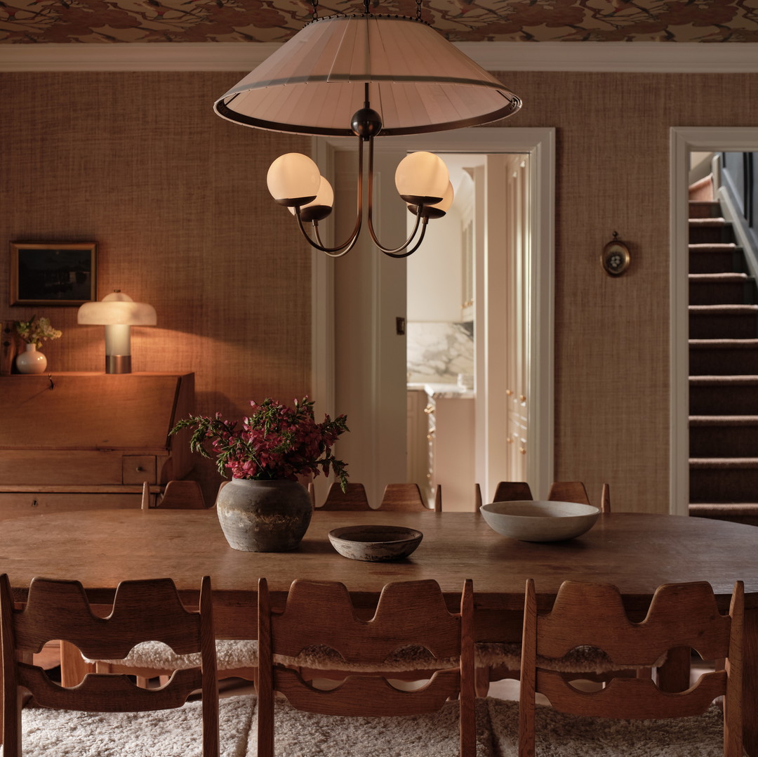 a dining room with a table and chairs
