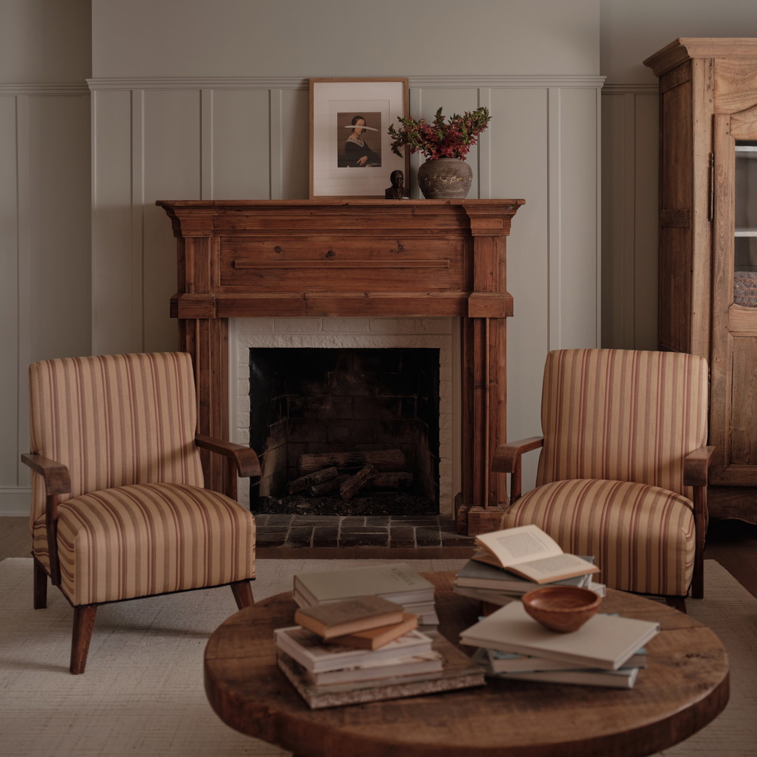 a living room filled with furniture and a fire place