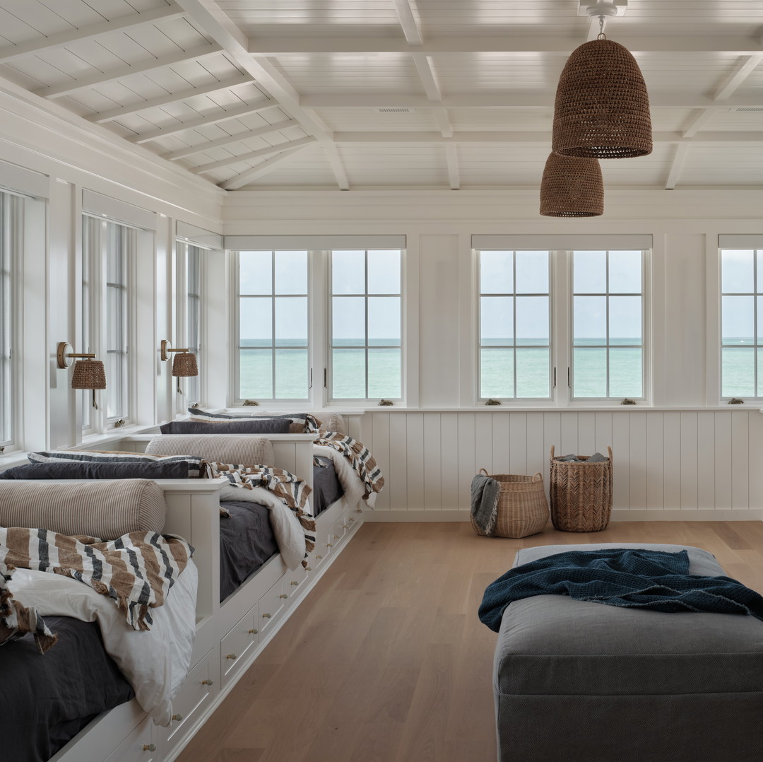 a room with a bunch of beds in it