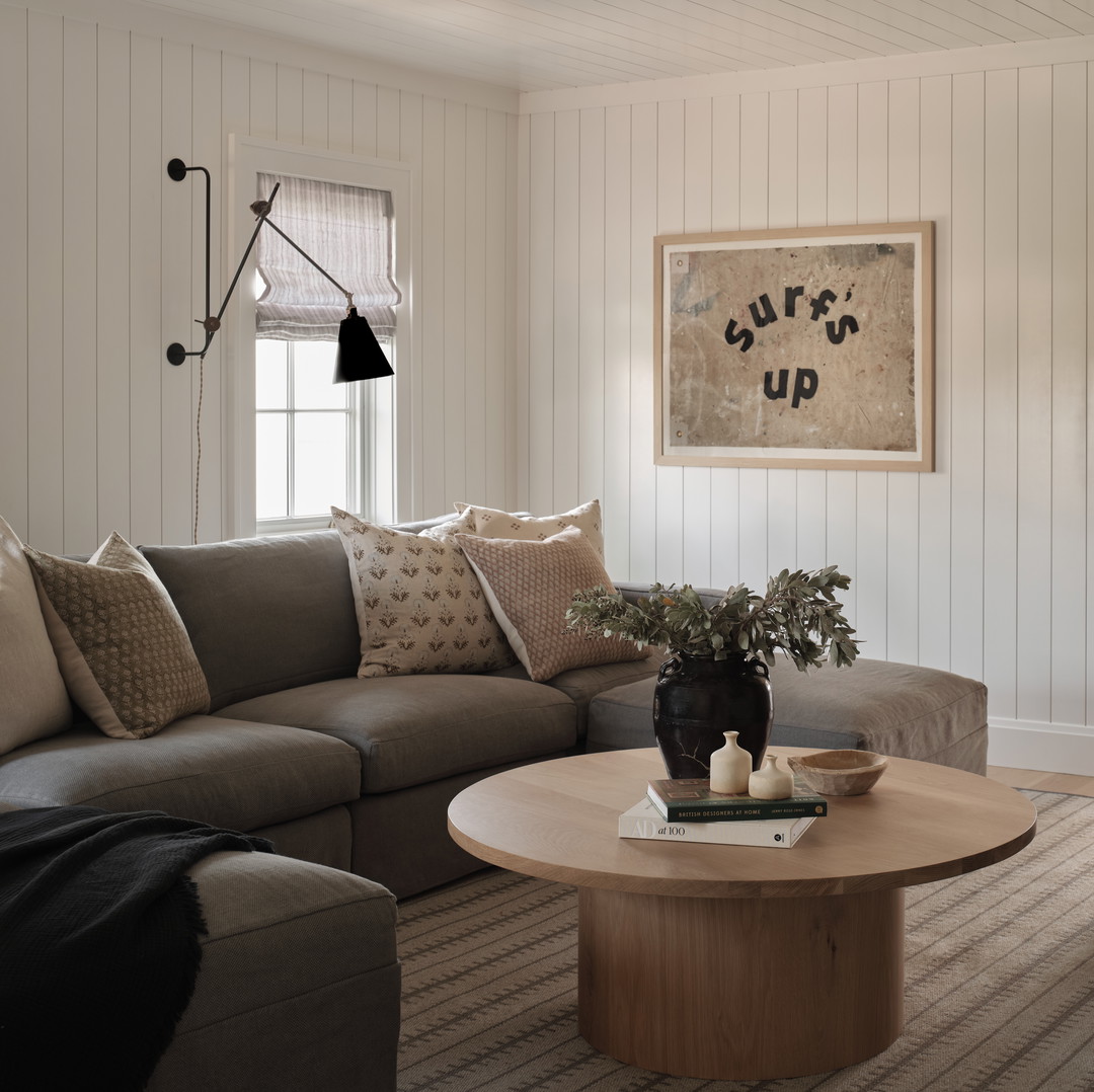 a living room filled with furniture and a coffee table