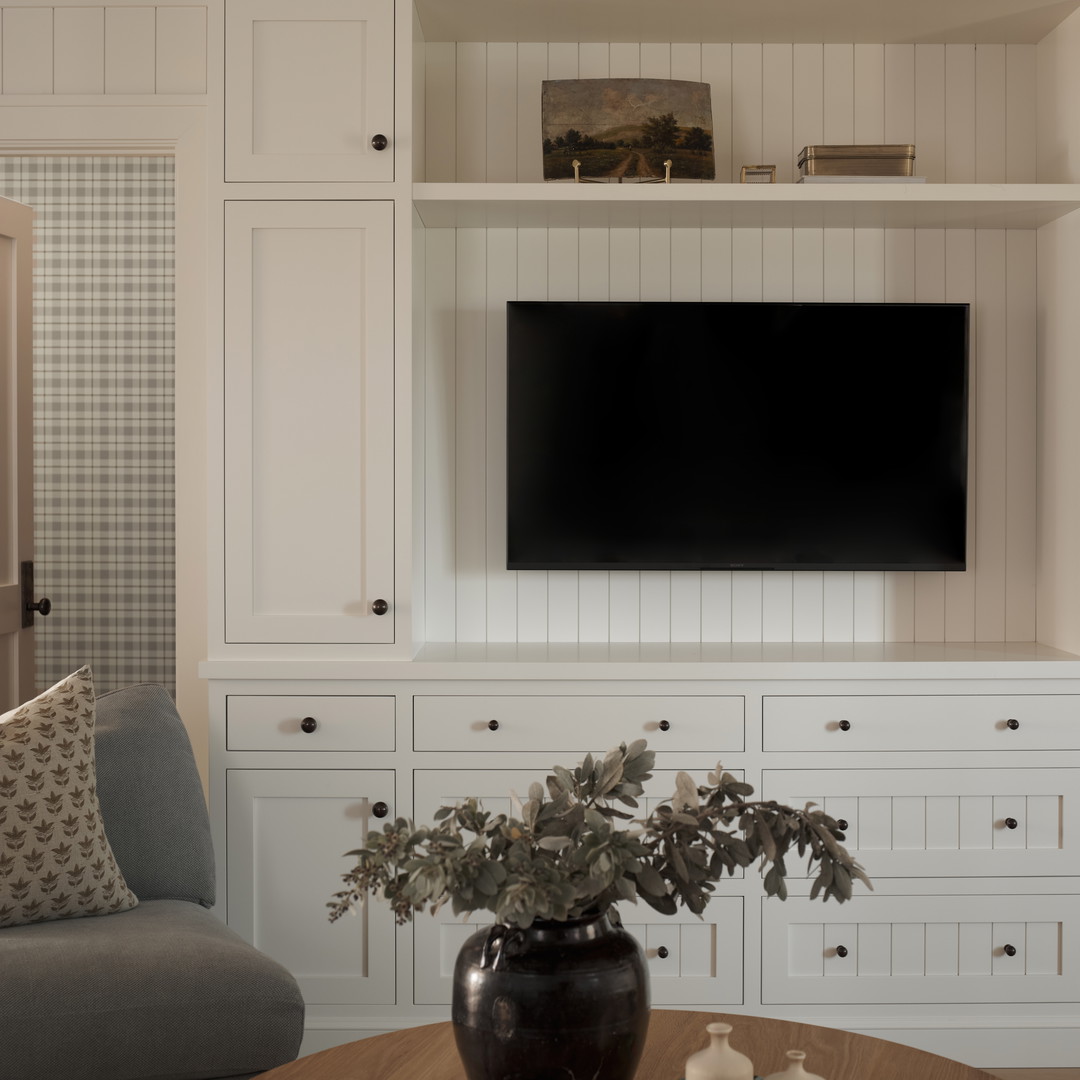 a living room with a couch and a television