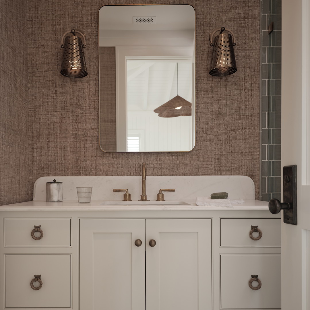 a bathroom with two sinks and a mirror