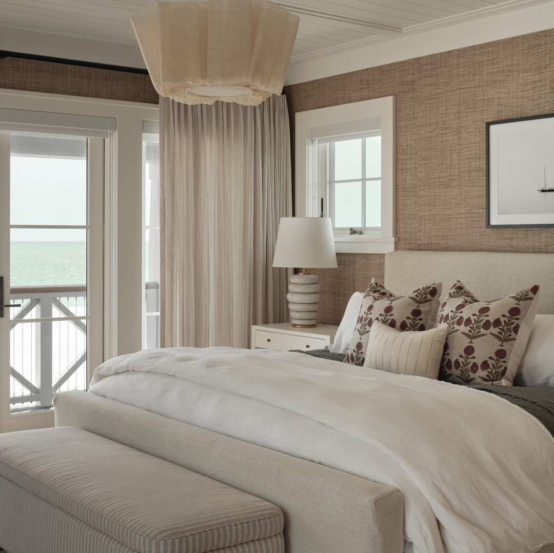 a bedroom with a large bed and a balcony