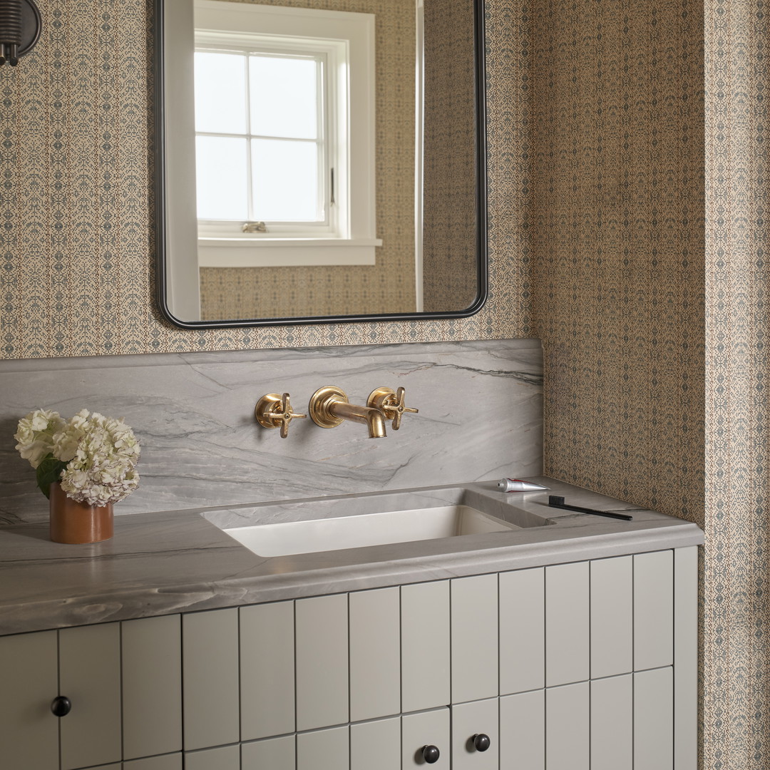 a bathroom sink with a mirror above it