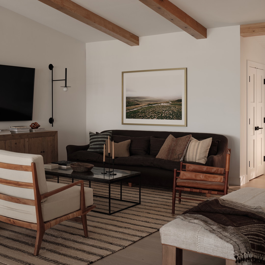 a living room filled with furniture and a flat screen tv