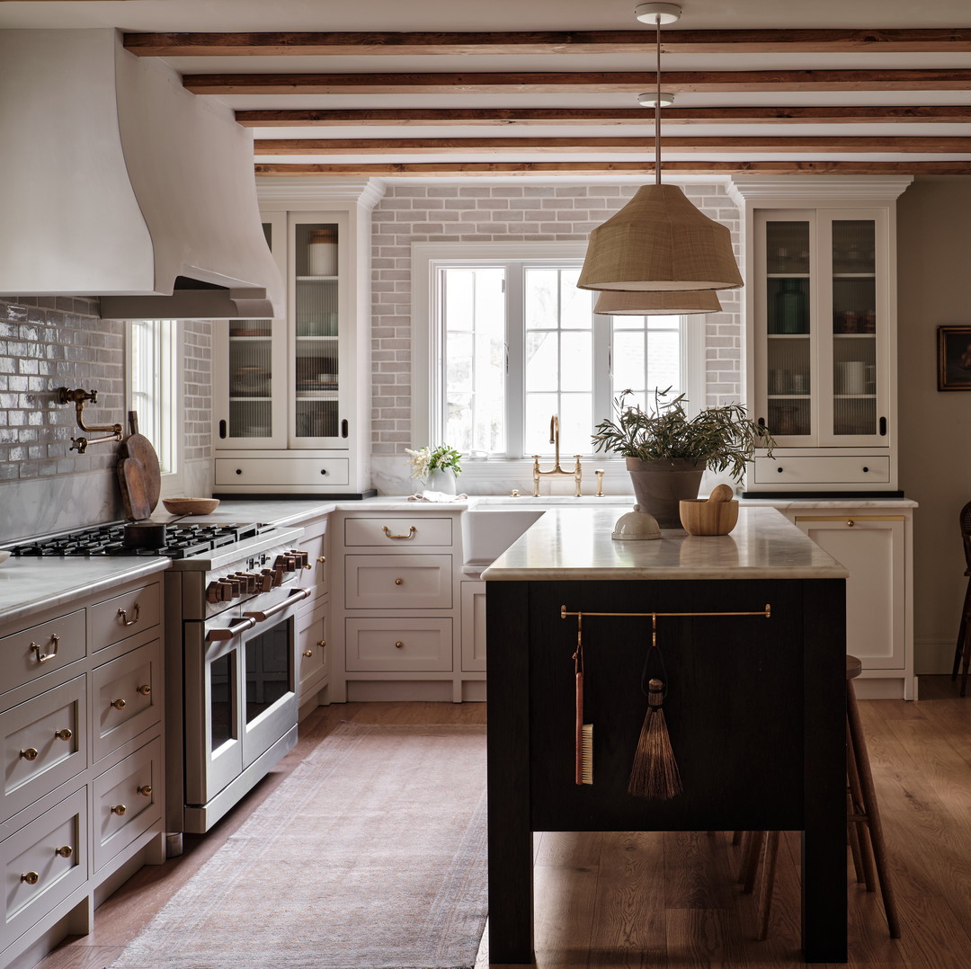 a kitchen with a center island and a stove top oven