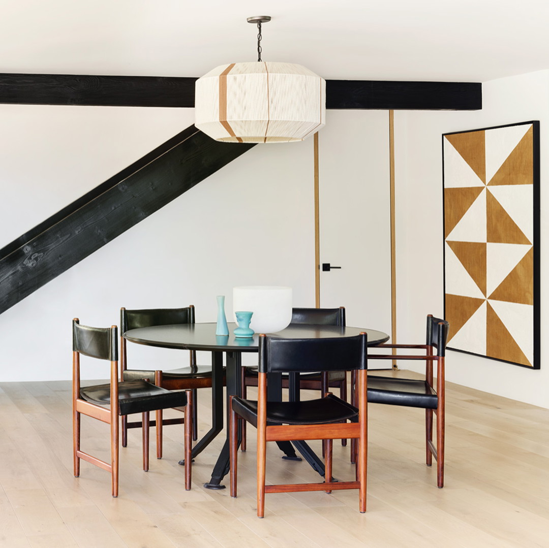 a dining room with a table and chairs