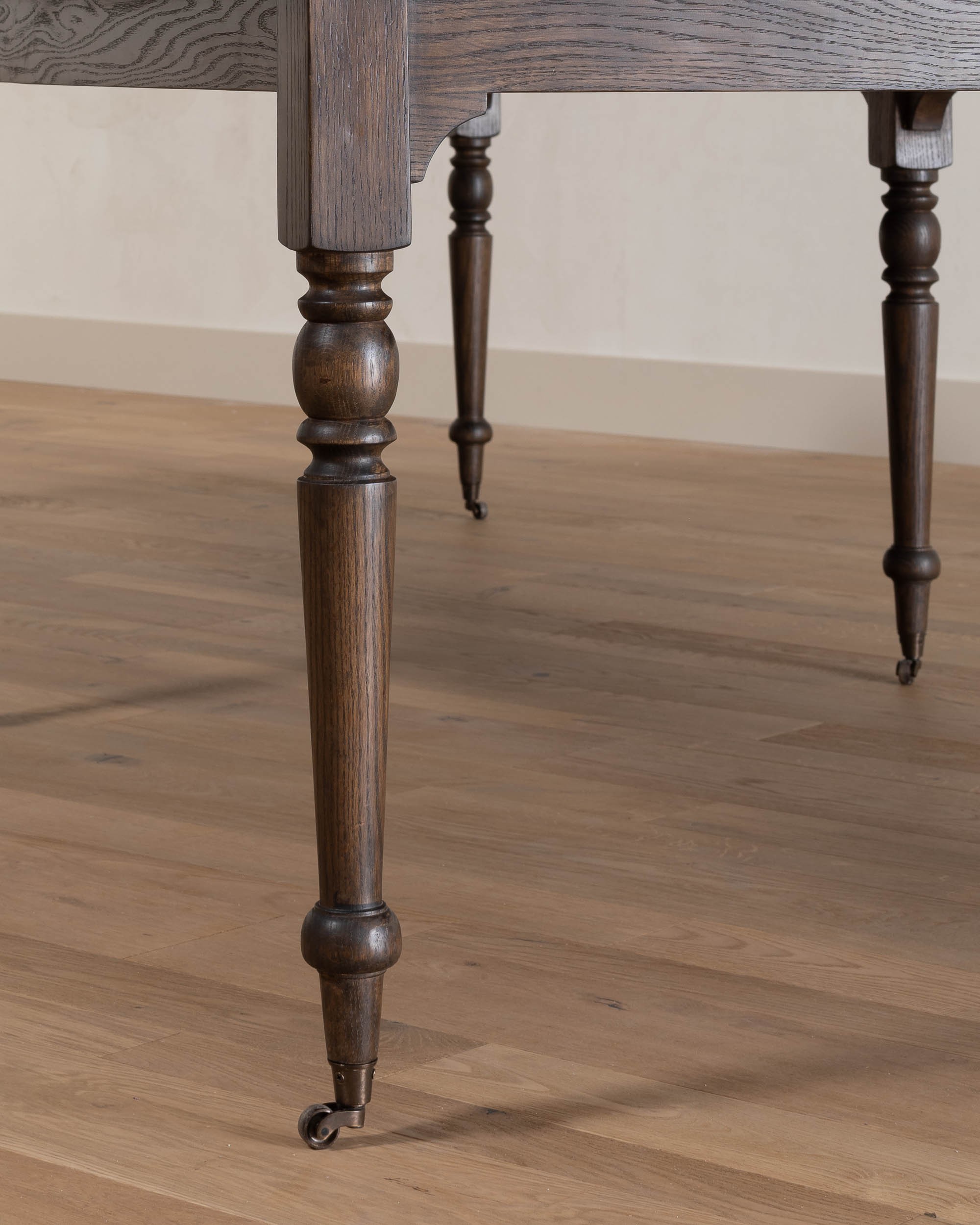 a close up of a wooden table on a hard wood floor