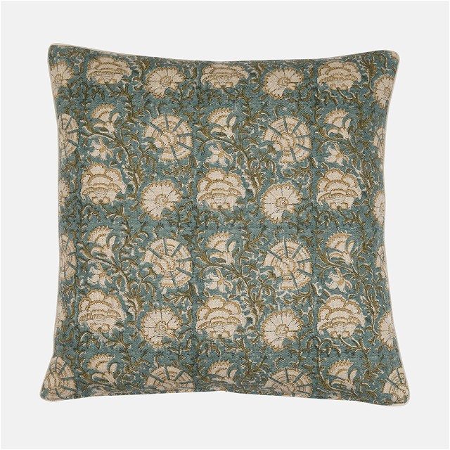 a blue and beige pillow with a floral pattern