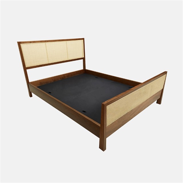 a bed with a wooden frame and headboard