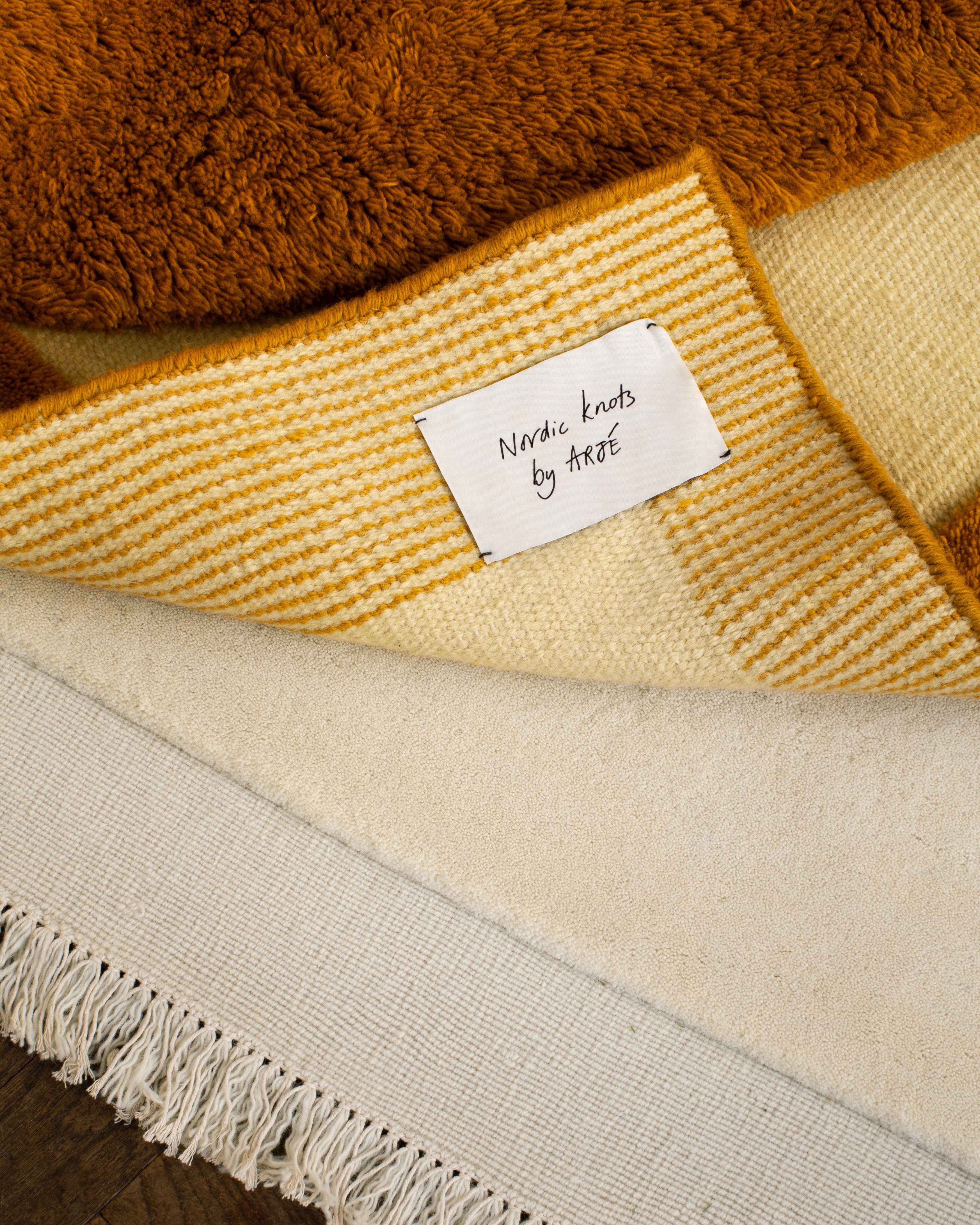 a label on a brown and white blanket