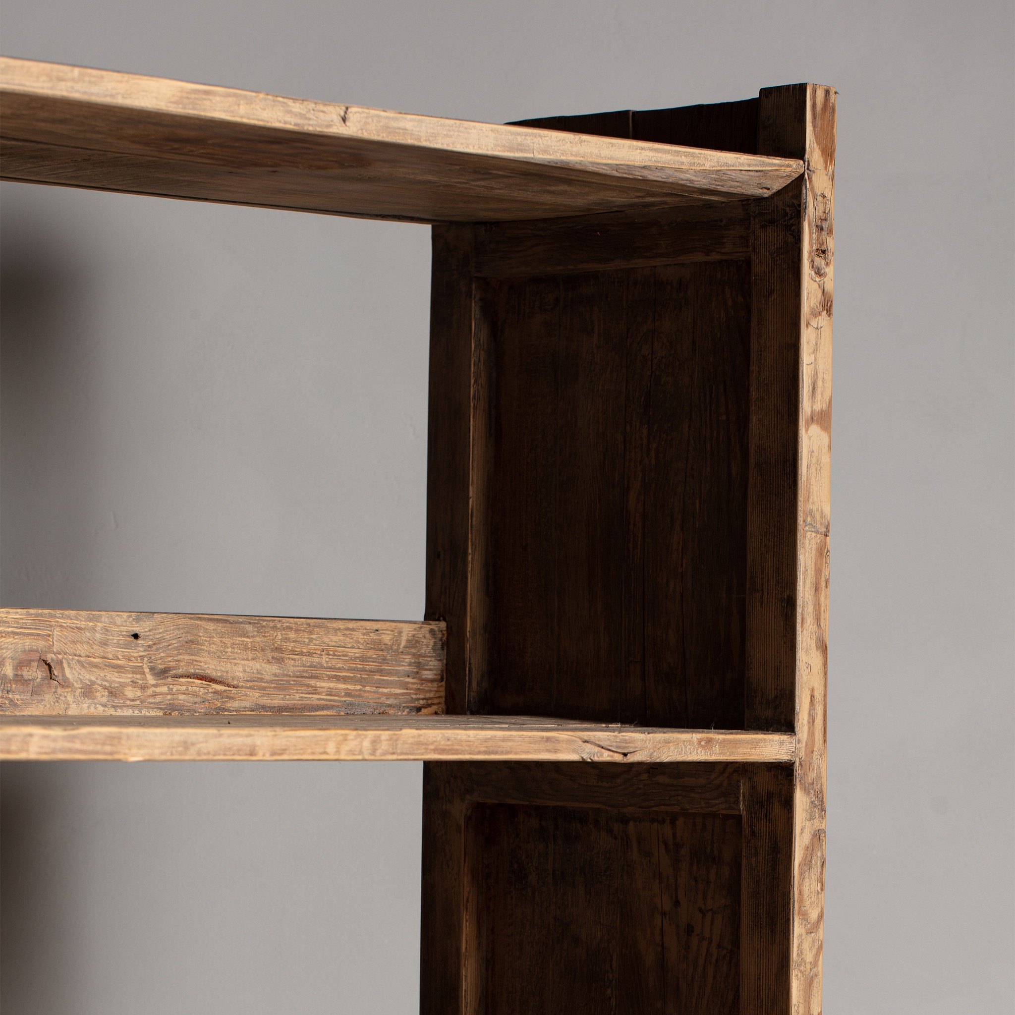 a wooden shelf with two open shelves on top of it