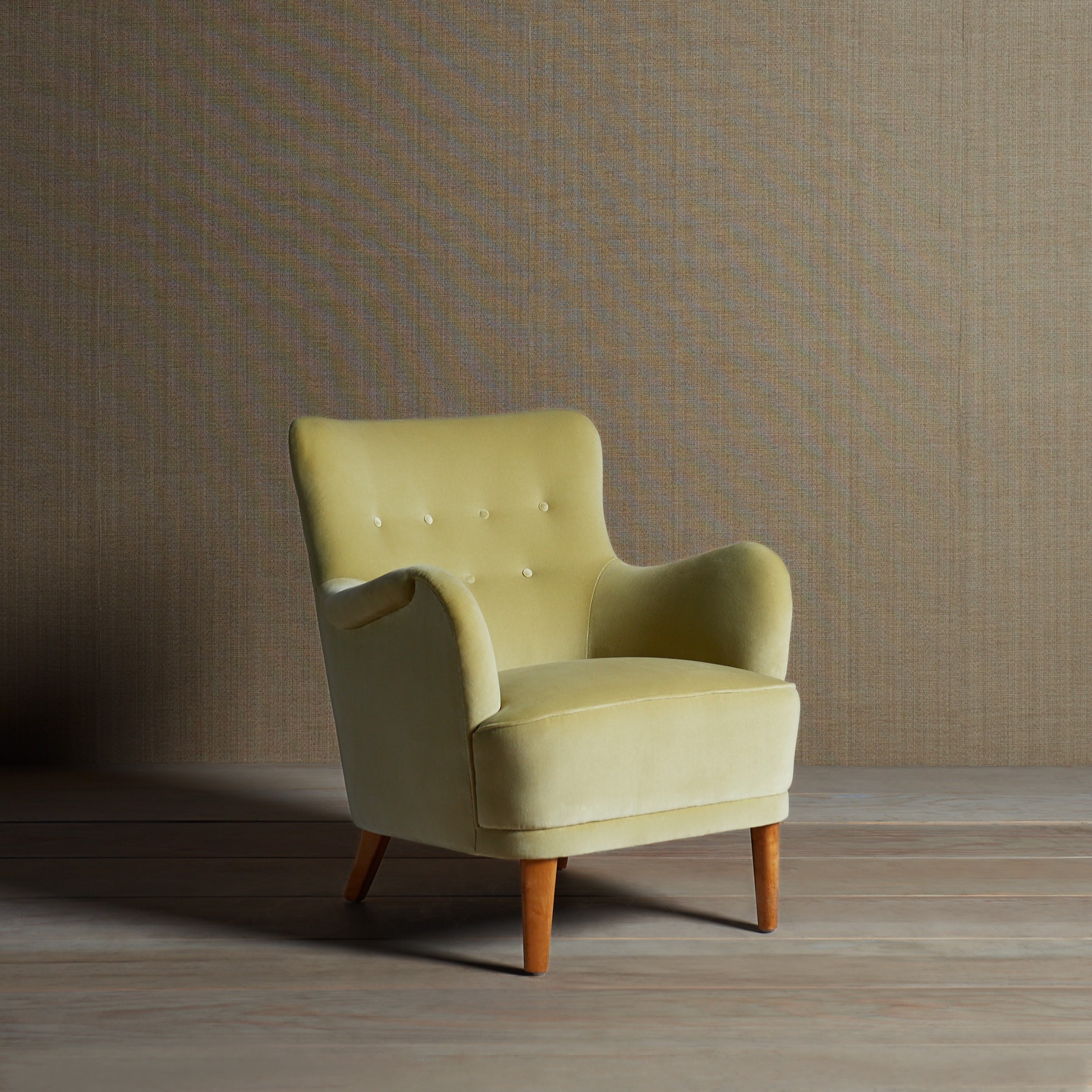 a yellow chair sitting on top of a hard wood floor