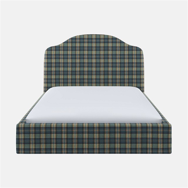 a bed with a plaid headboard and foot board