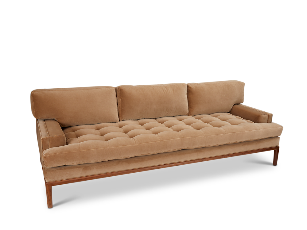 a couch with a wooden frame and a tan colored upholstered