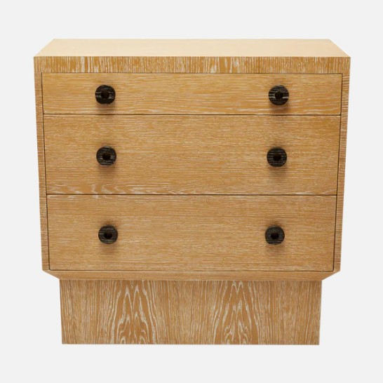 a wooden chest of drawers with four drawers