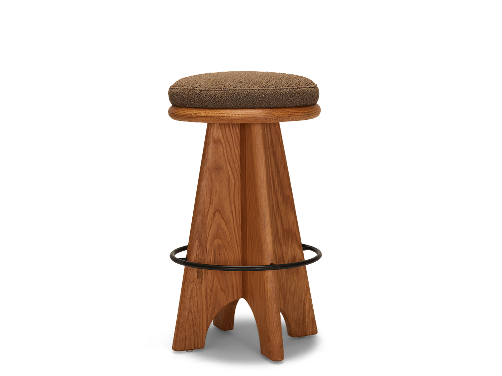 a wooden stool with a brown cushion on top of it