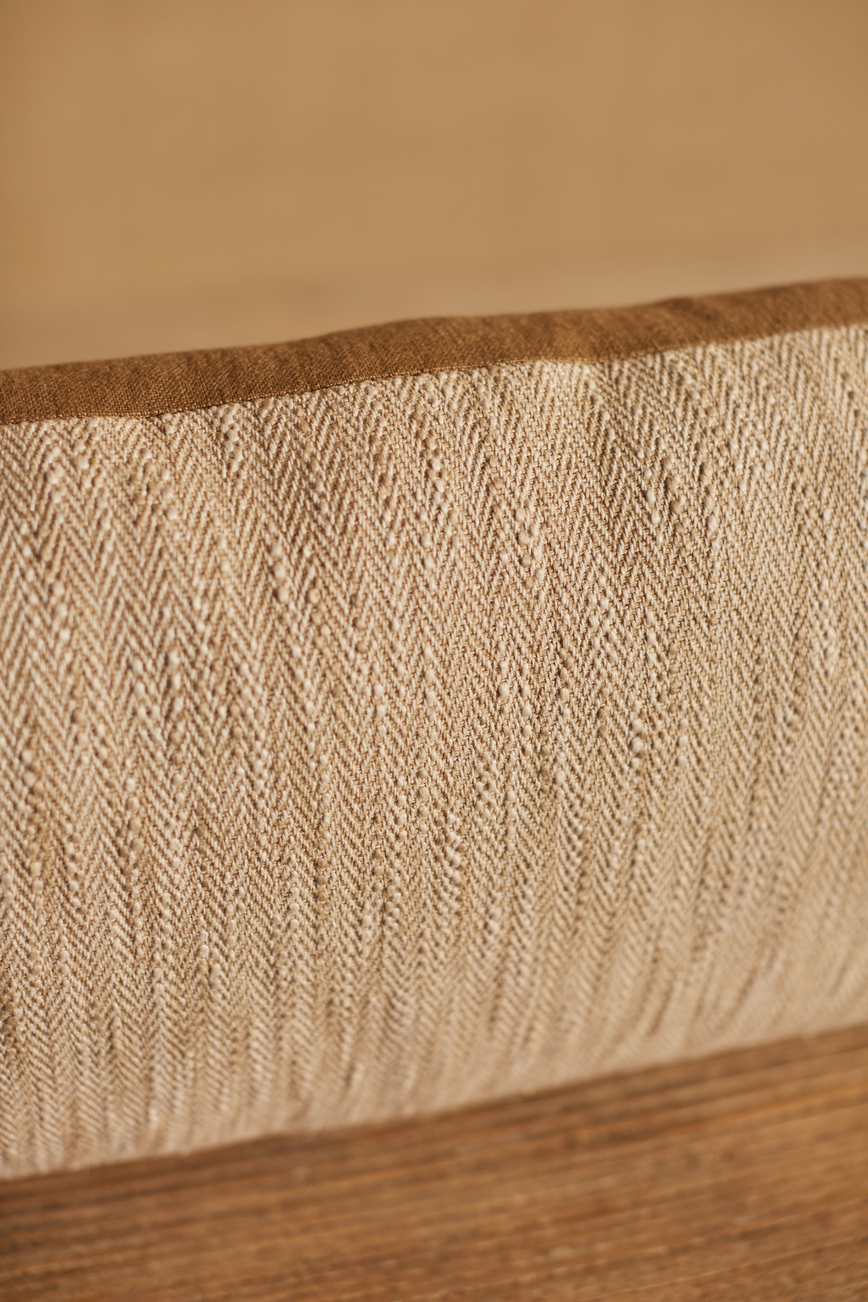 a close up of a piece of fabric on a wooden surface