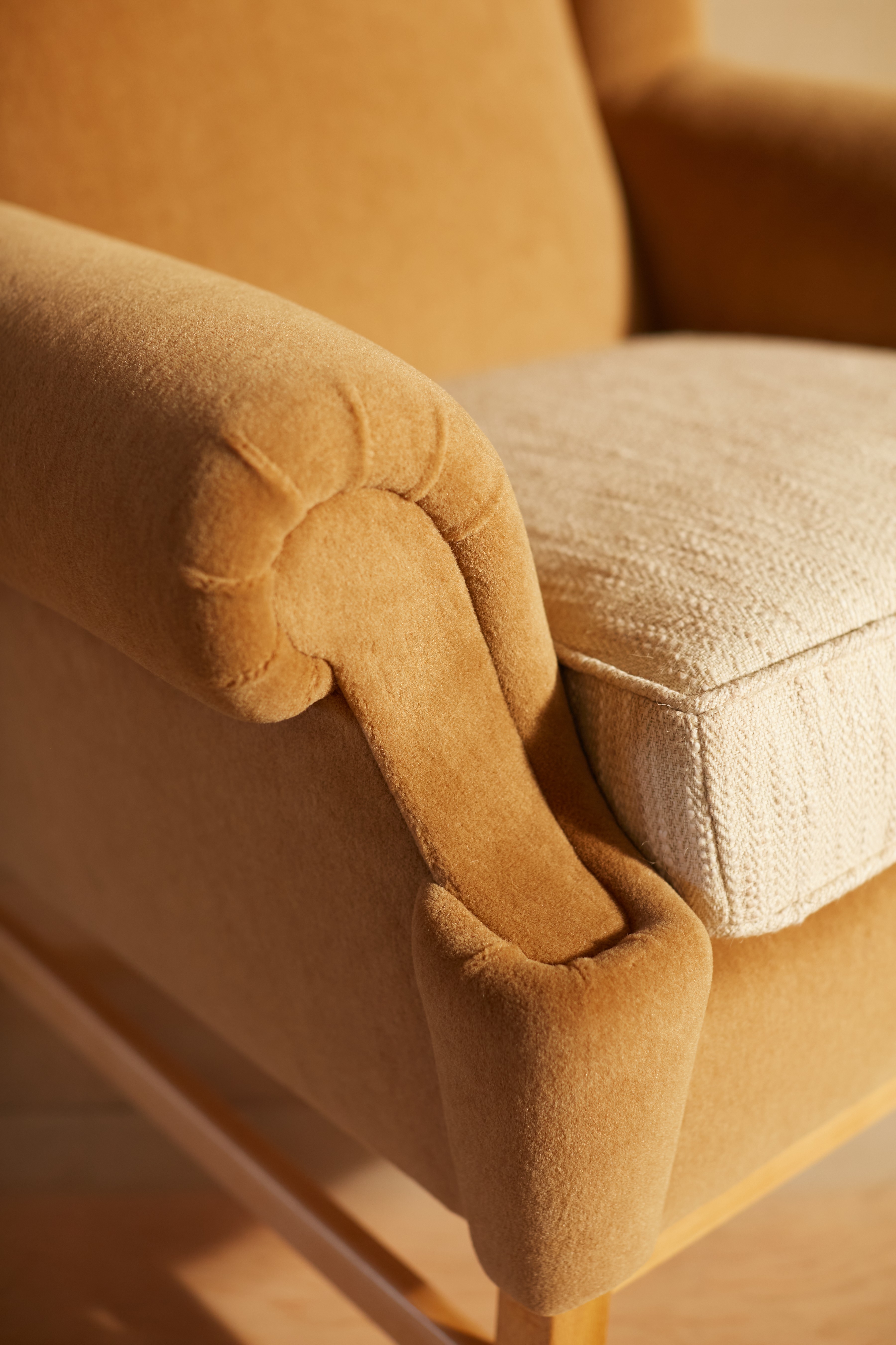 a close up of a chair with a cushion on it