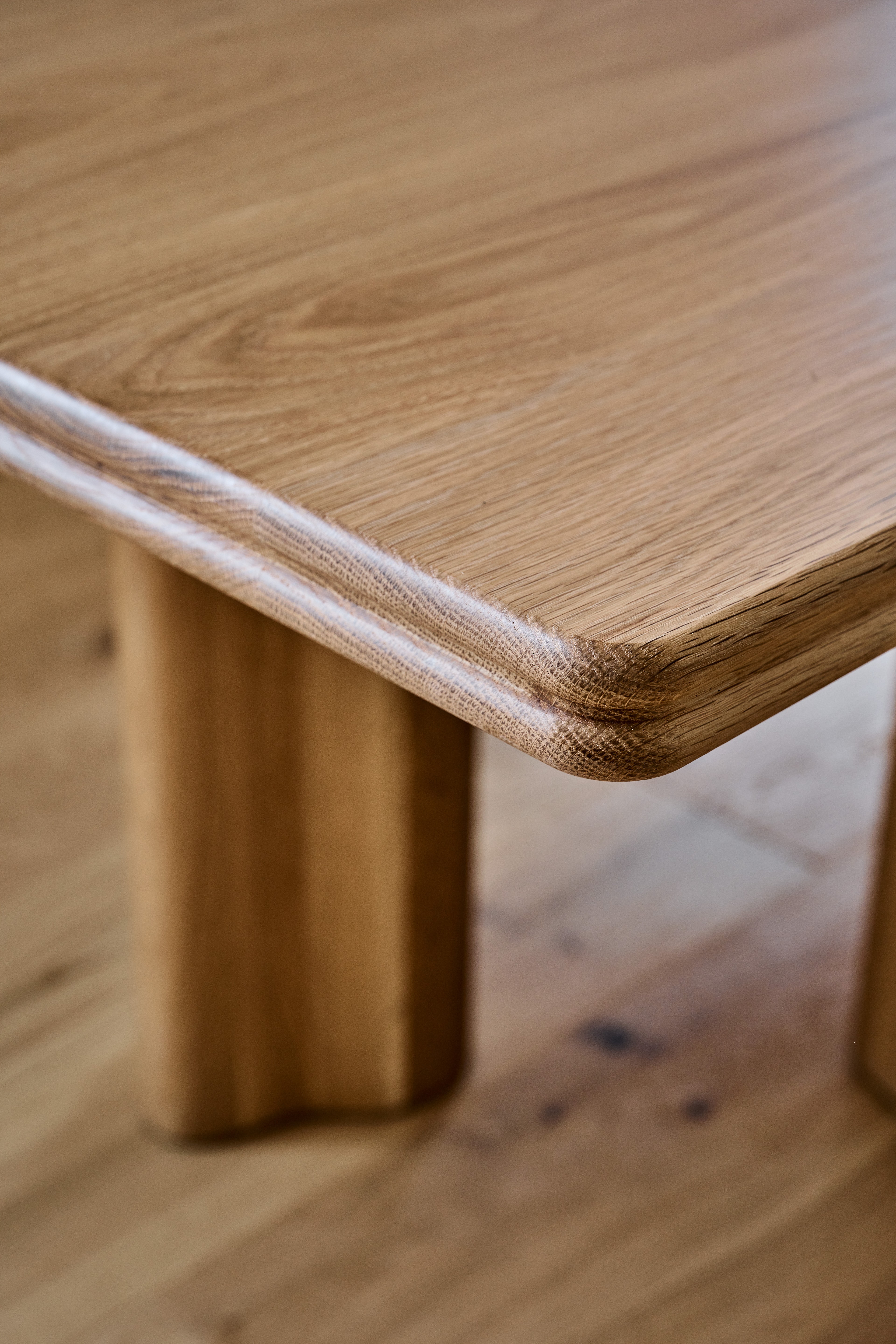 a close up of a wooden table on a hard wood floor