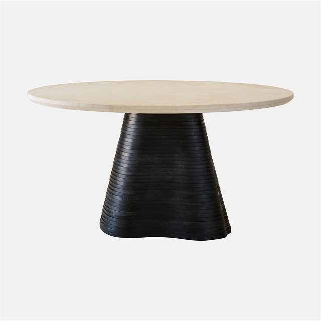 a round table with a black base and a white top