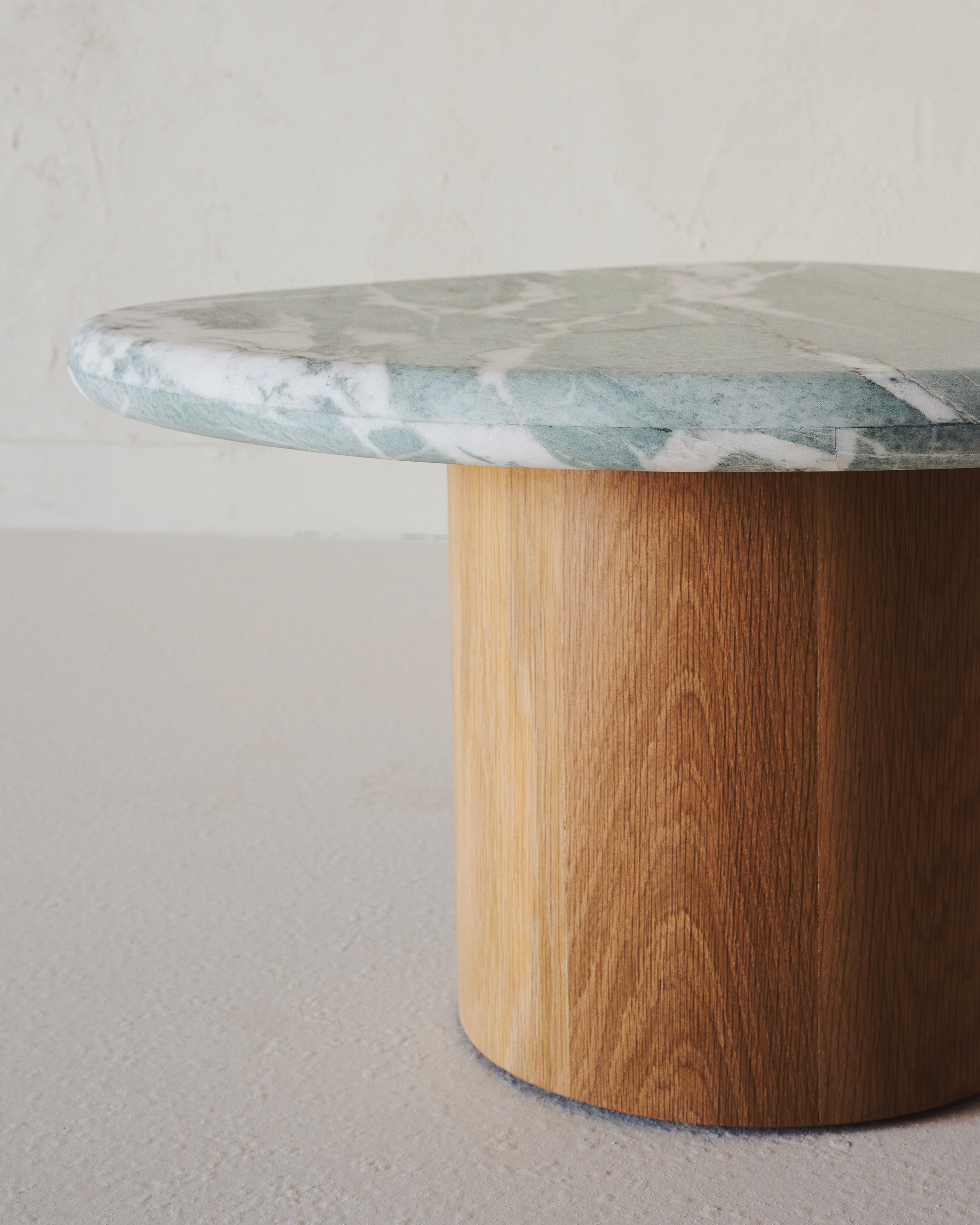 a marble top table with a wooden base