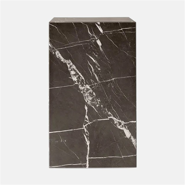 a black and white marble block on a white background