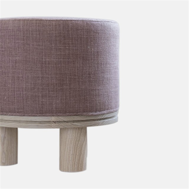a small stool with a wooden base and a light purple cover