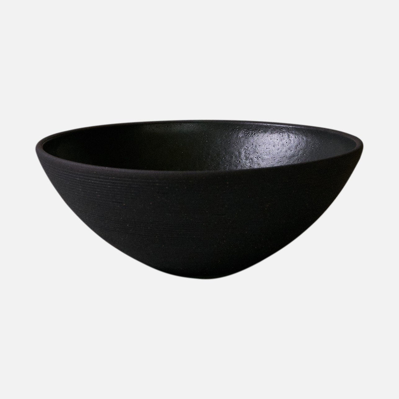 a black bowl on a white background