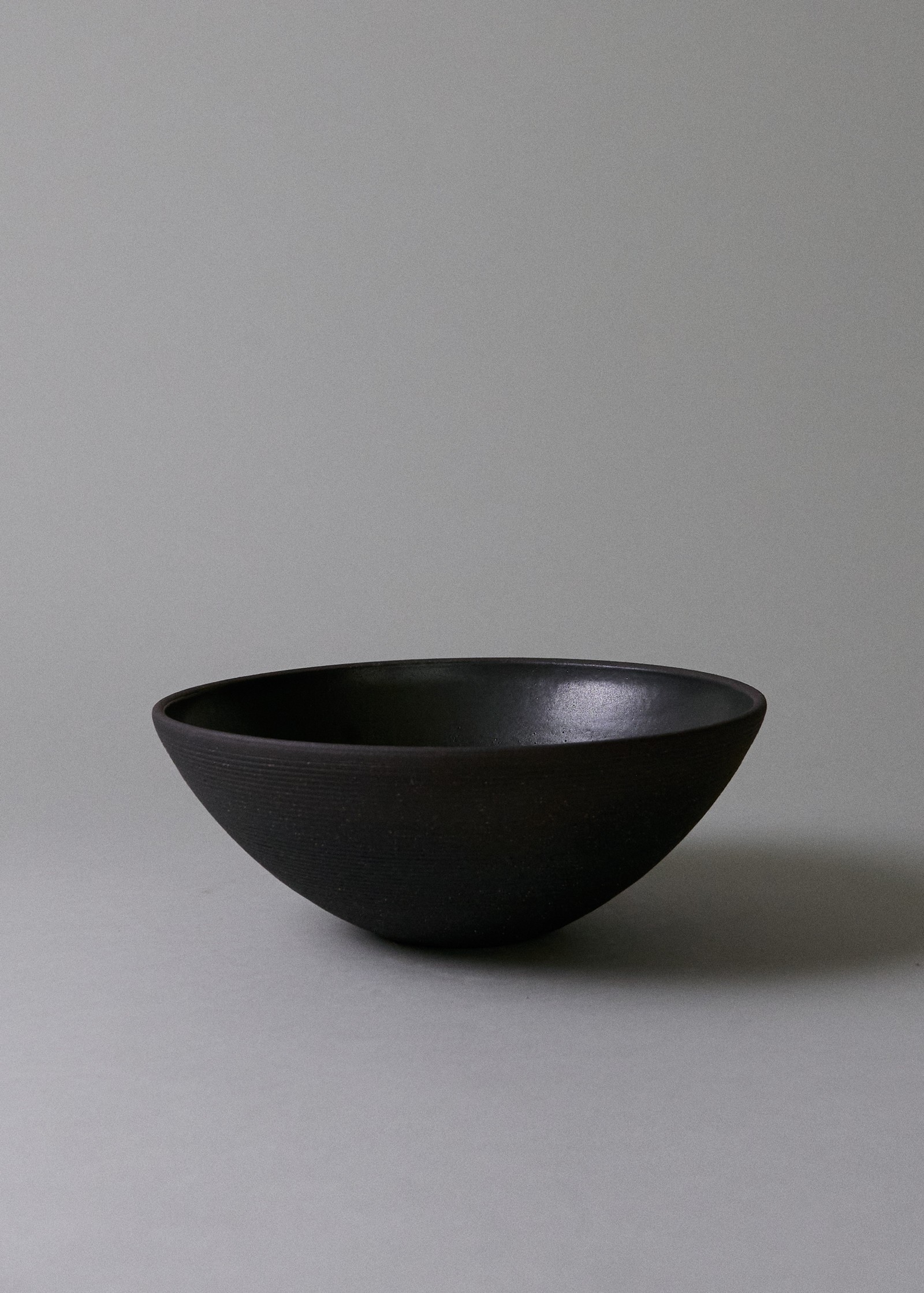 a black bowl sitting on top of a table