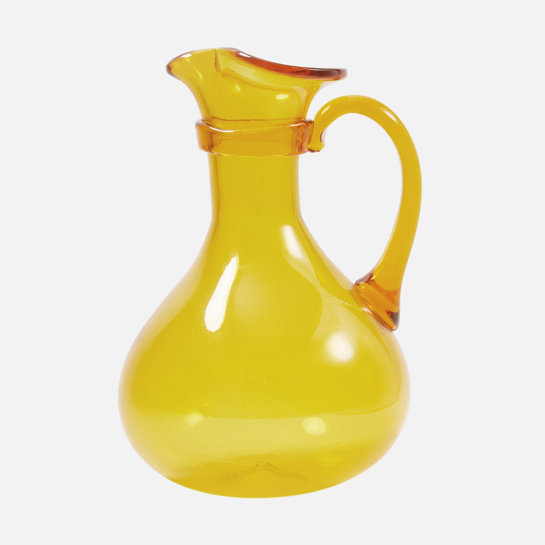 a yellow glass pitcher is shown against a white background