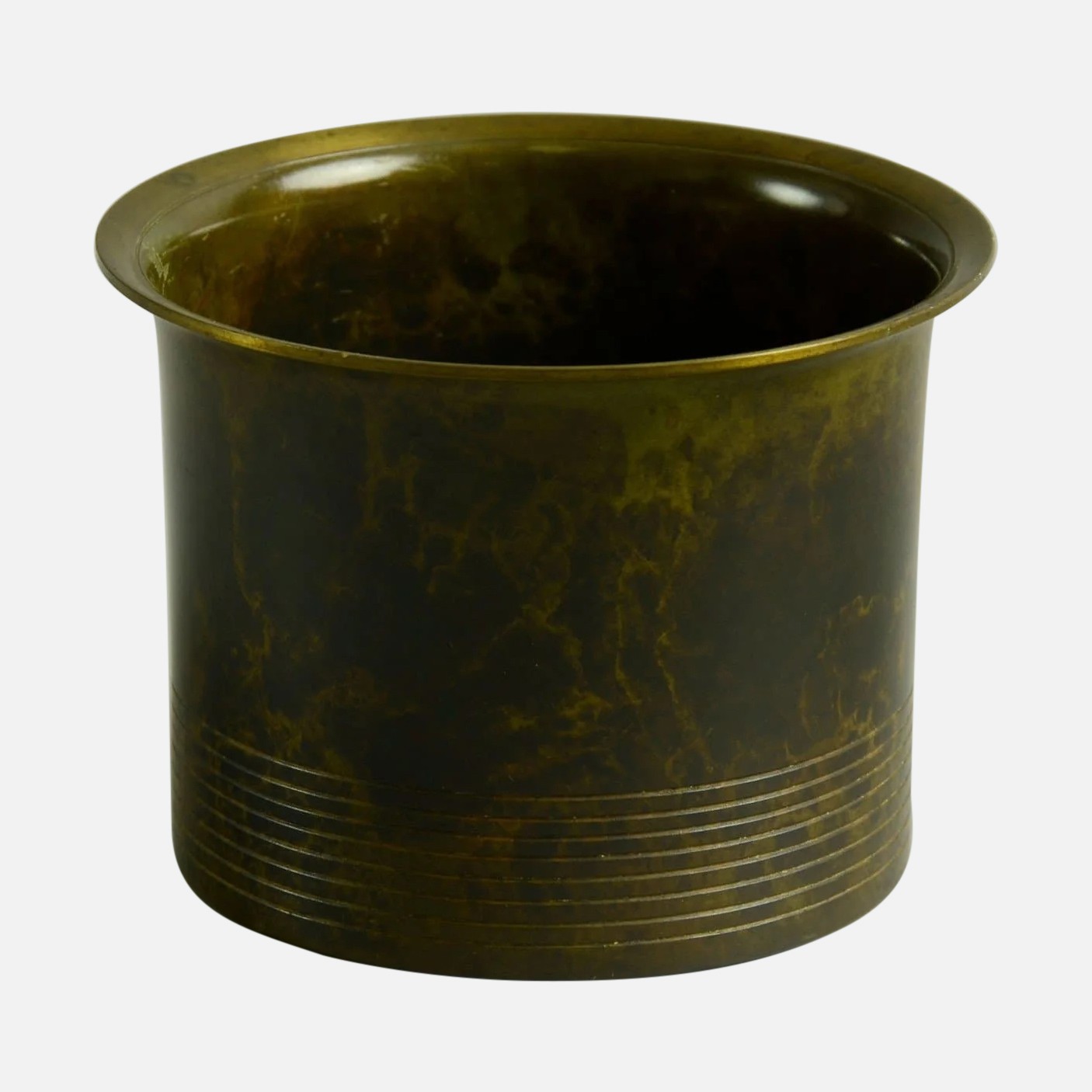 a round metal container with a brown pattered finish