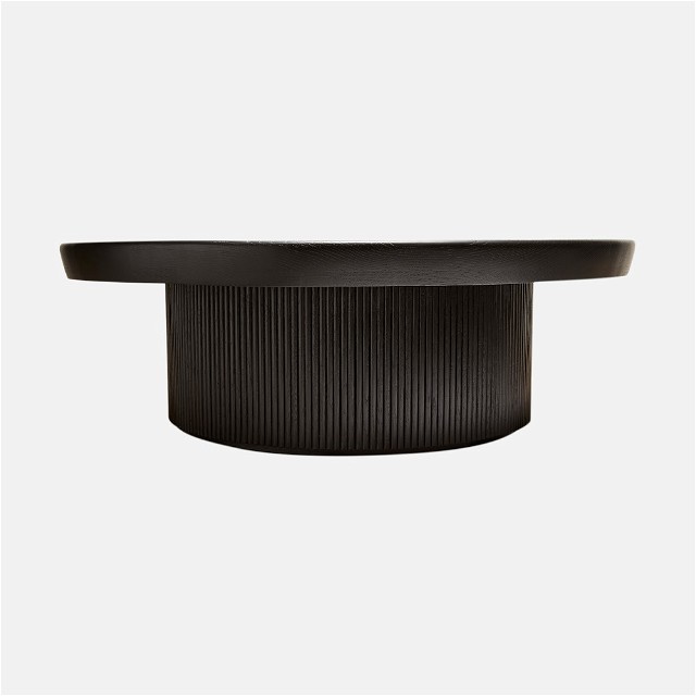 a black table with a curved top