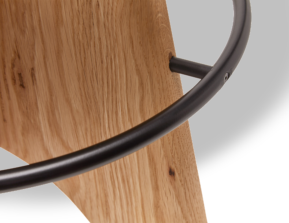 a close up of a wooden shelf with a black metal handle