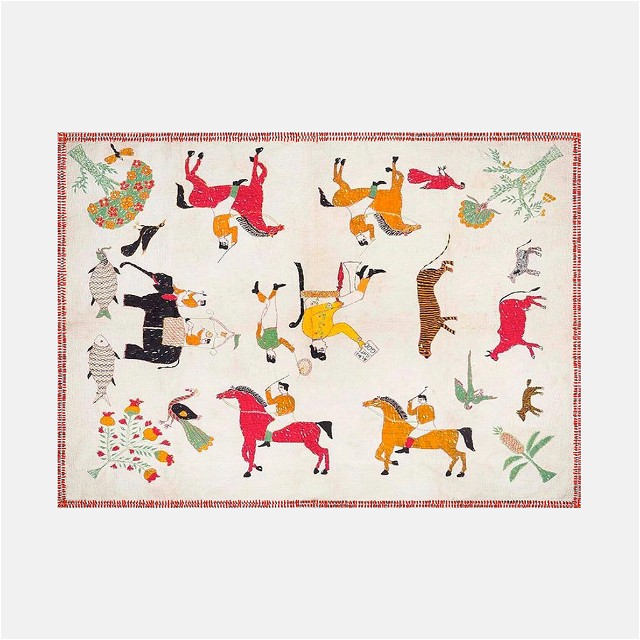 a picture of a rug with animals on it
