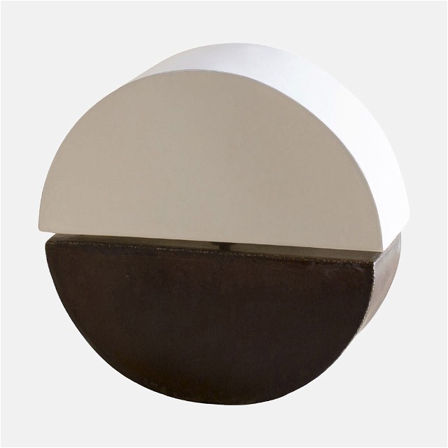 a white and brown circular object on a white background