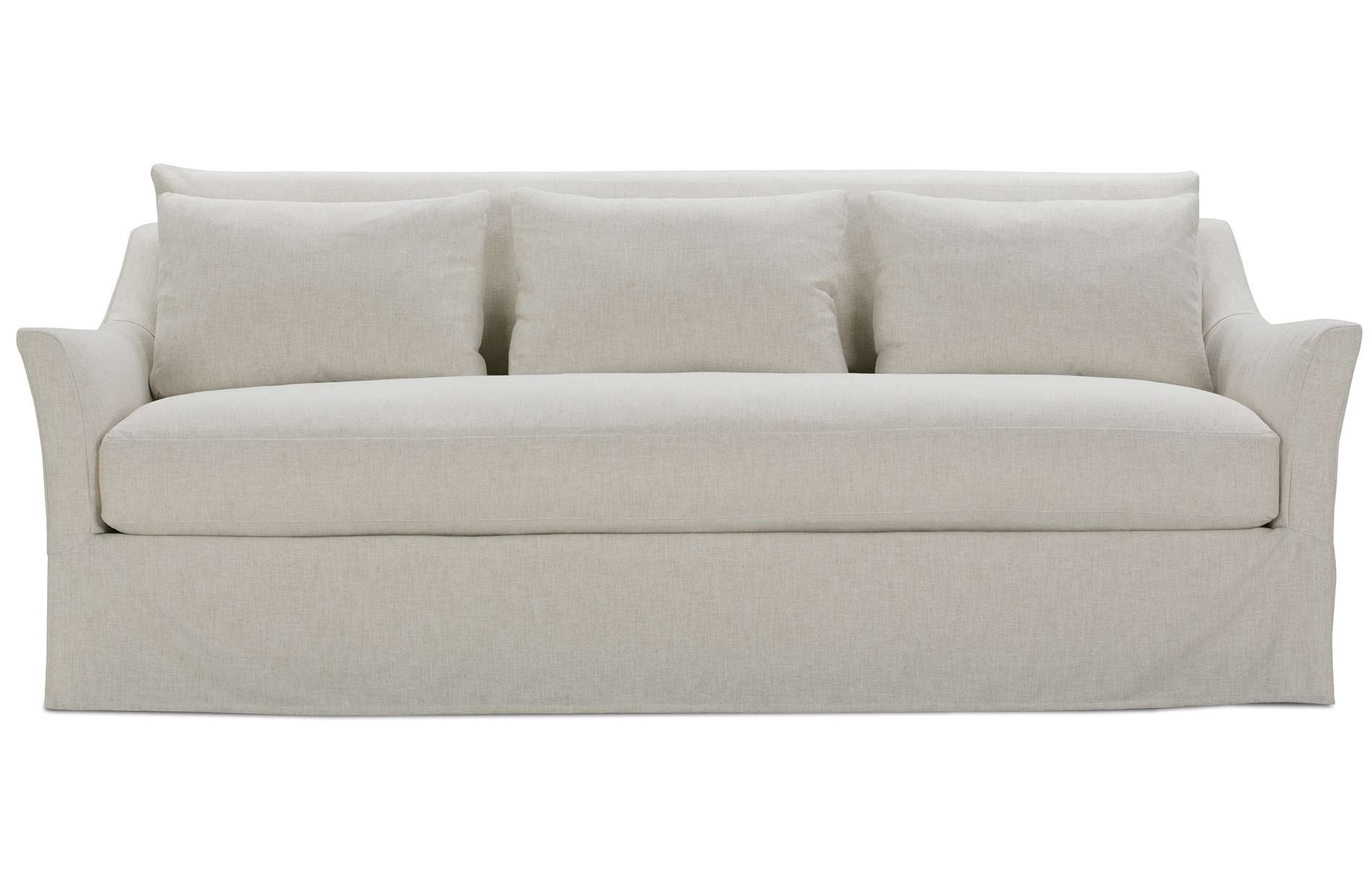 a white couch with four pillows on it
