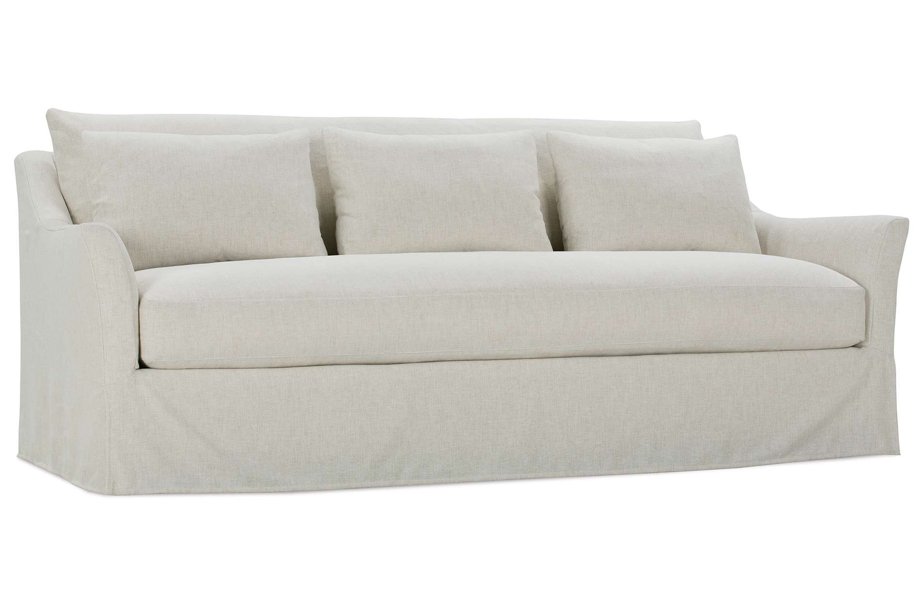 a white couch with four pillows on it
