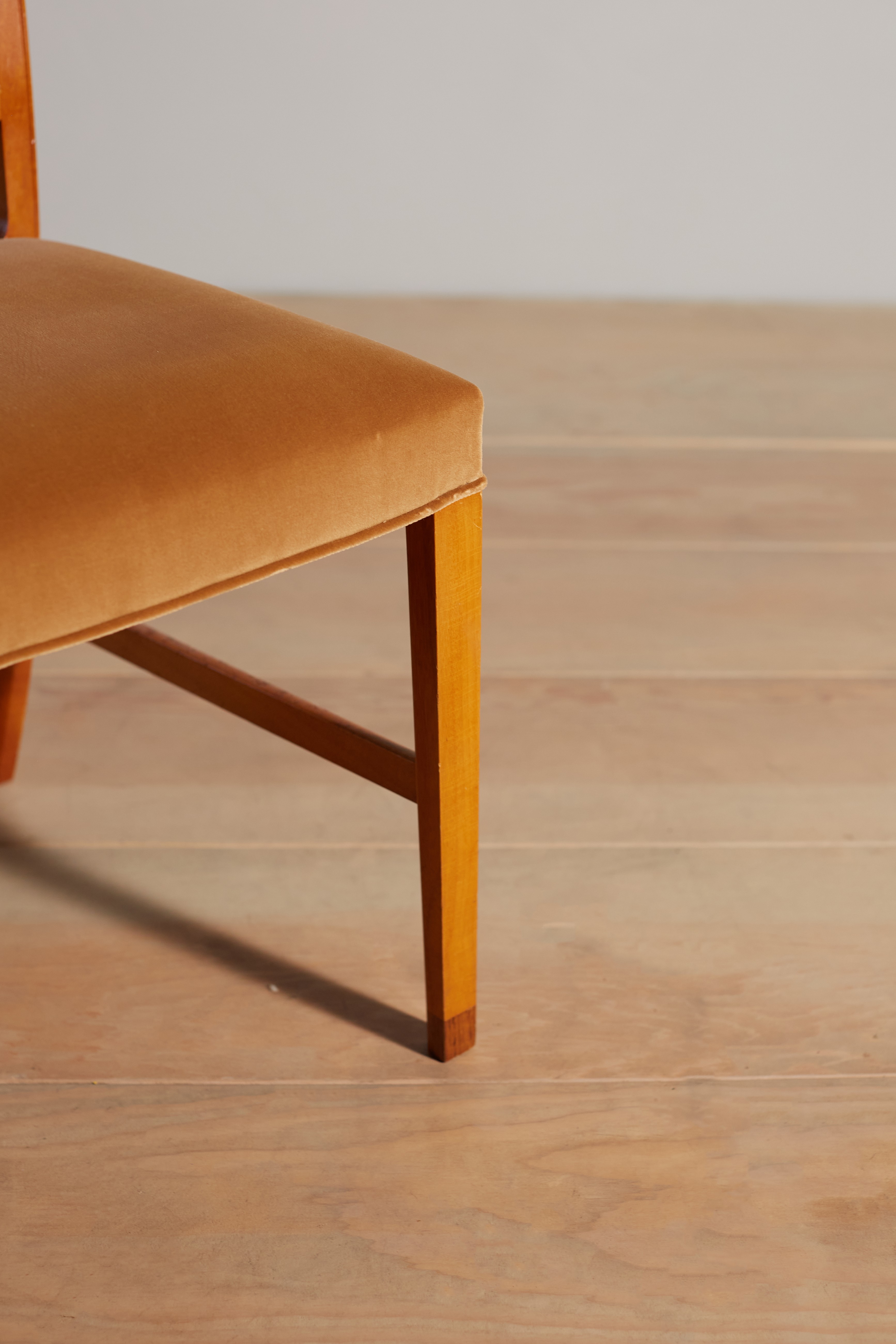 a wooden chair sitting on top of a hard wood floor