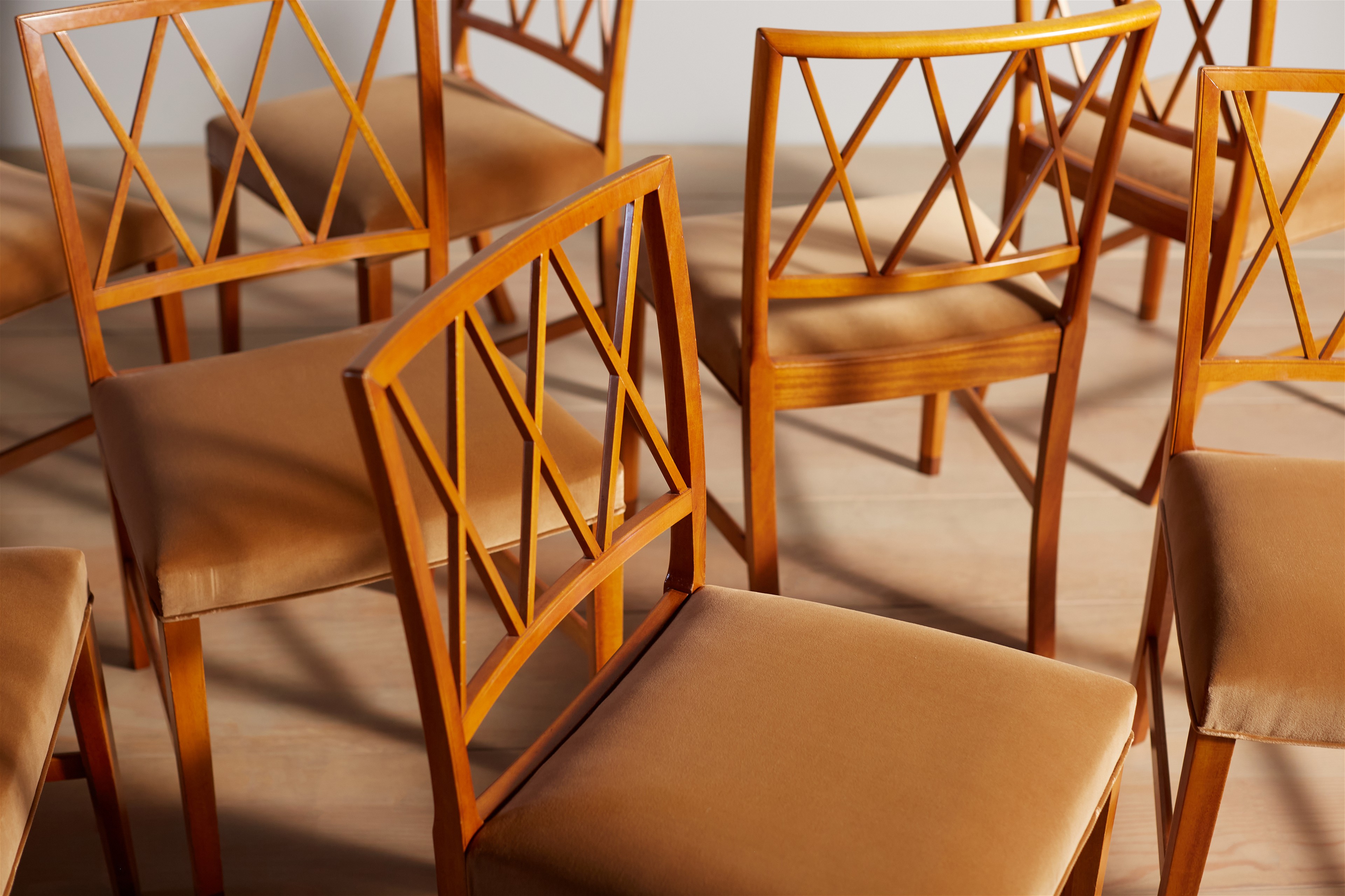 a group of wooden chairs sitting next to each other