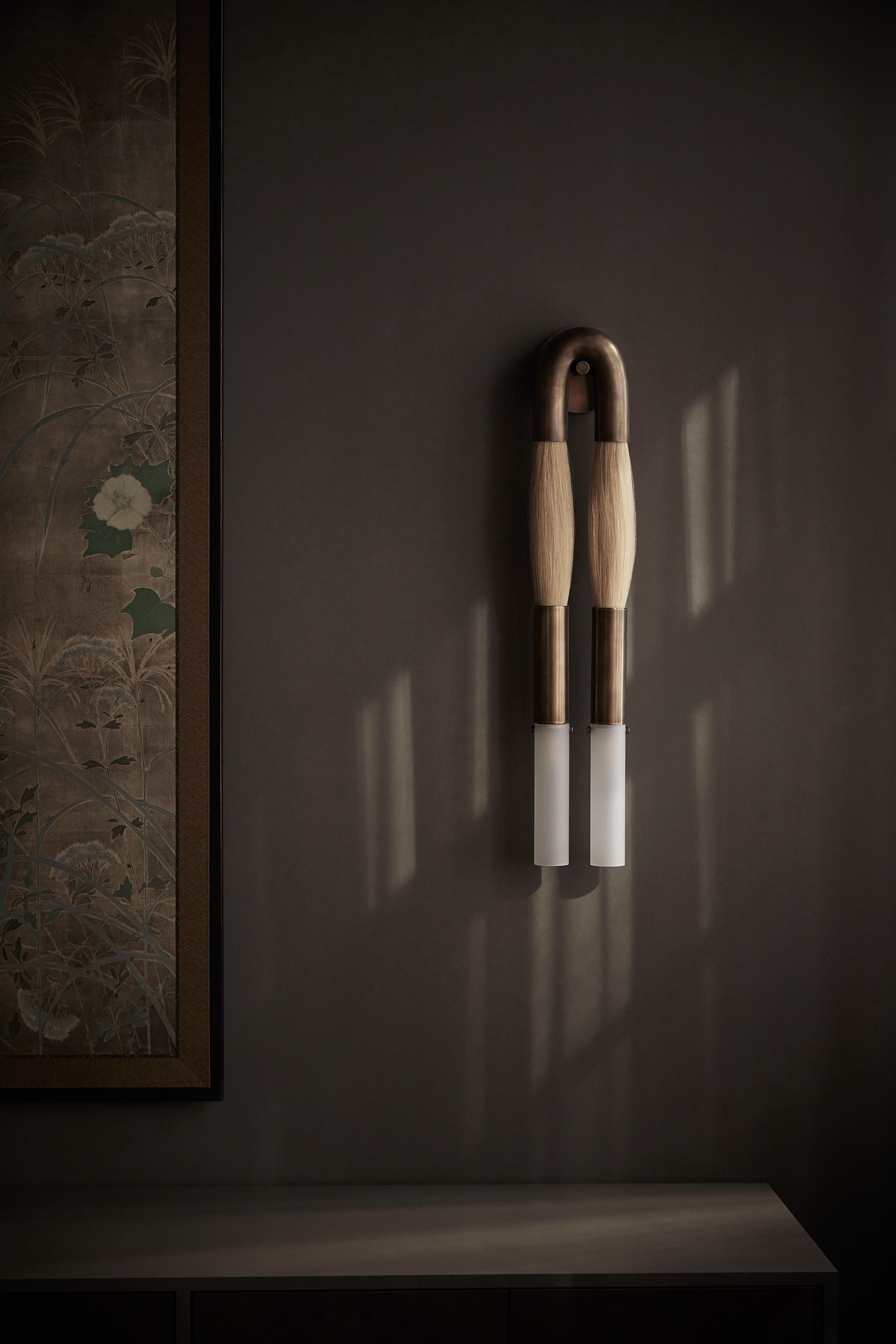 a couple of wooden spoons hanging on a wall
