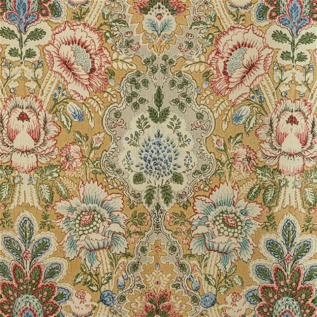 a close up of a rug with flowers on it