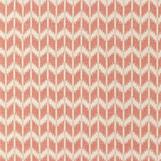 an orange and white pattern on fabric
